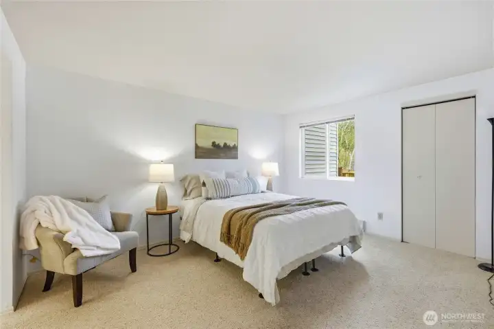 Primary bedroom with natural light and spacious layout