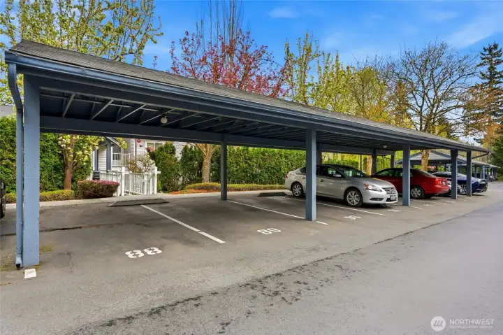 Covered parking with designated space and additional guest parking