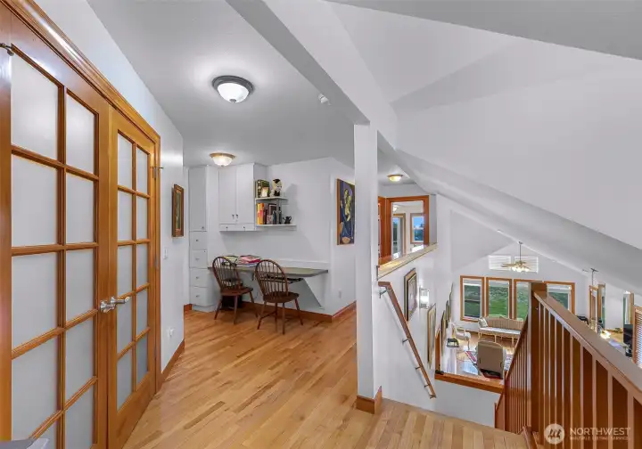 Upstairs landing looking towards 2nd & 3rd bedrooms and built in office space.