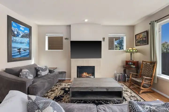 Living room with oversized windows, neutral finishes, and flexible furniture layout options.