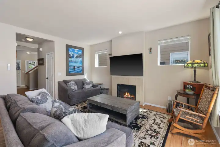 Additional view of the living room showcasing the open-concept layout and connection to the kitchen and dining area.