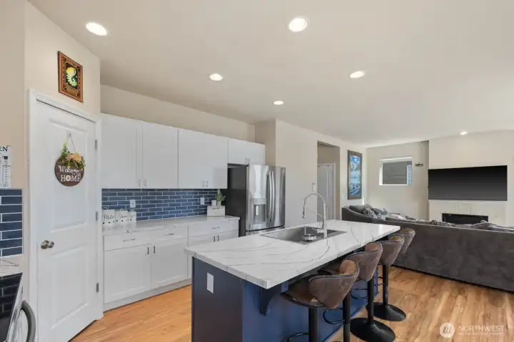 Additional kitchen view showcasing the oversized island, contemporary finishes, and seamless connection to the main living space.