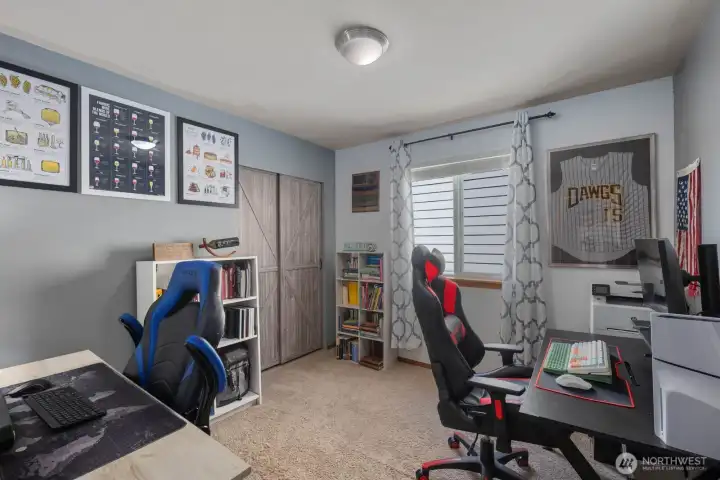 Flexible upstairs room with closet storage and space for a home office, gaming setup, guest room, or additional bedroom.