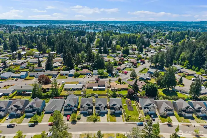 Neighborhood aerial view highlighting proximity to parks, water views, and surrounding community.