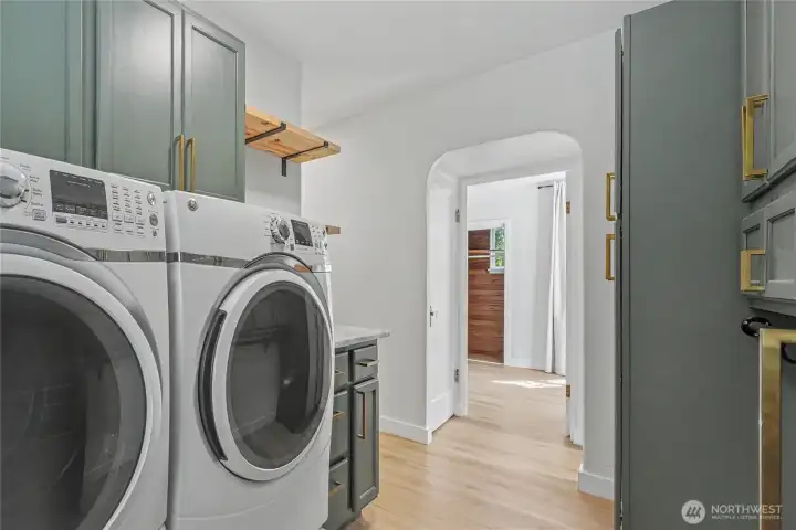 Additional laundry view.  The curved doorway adds charm to this space.