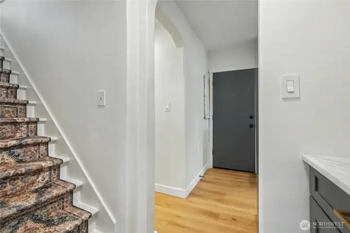 Stairway to two bedrooms and a half bath on the upper level.