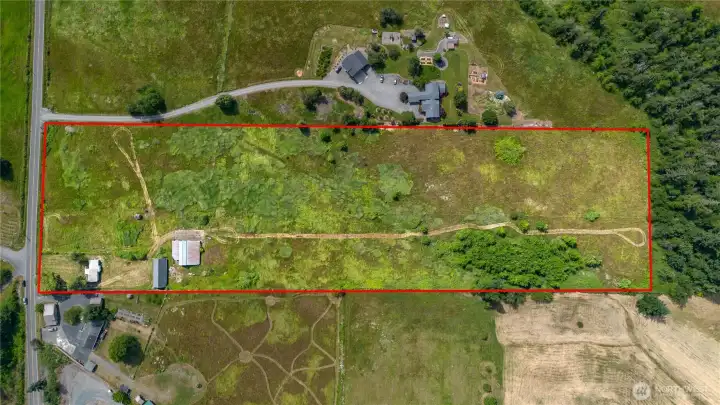 Roughly 9.80 acres of rolling pasture land.