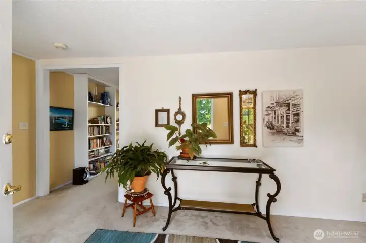 A cozy foyer to welcome you in. Door to the garage on the very left. Entrance to the living room through the opening on the left.
