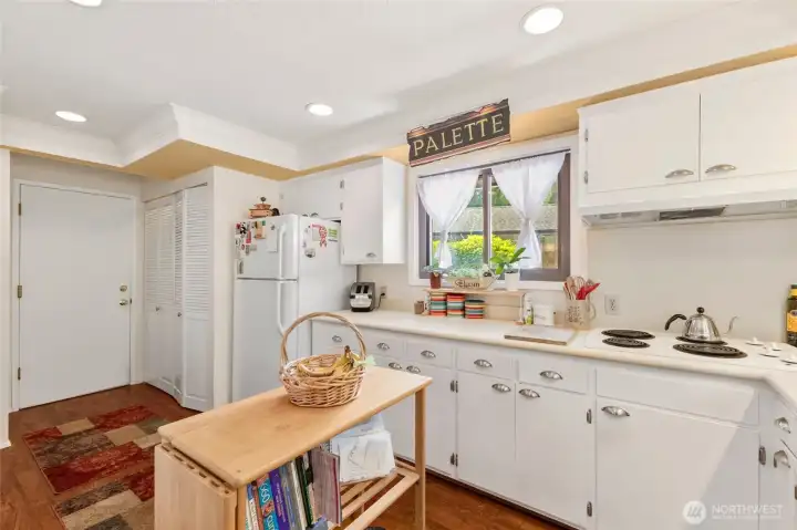 Kitchen with another garage door entrance.