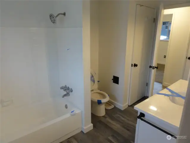 Bathroom. Has entry from primary bedroom and hallway.