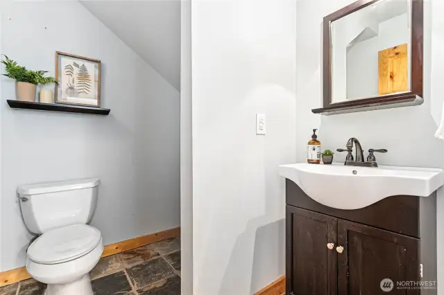 1/2 bath just off foyer & across hall from office/den
