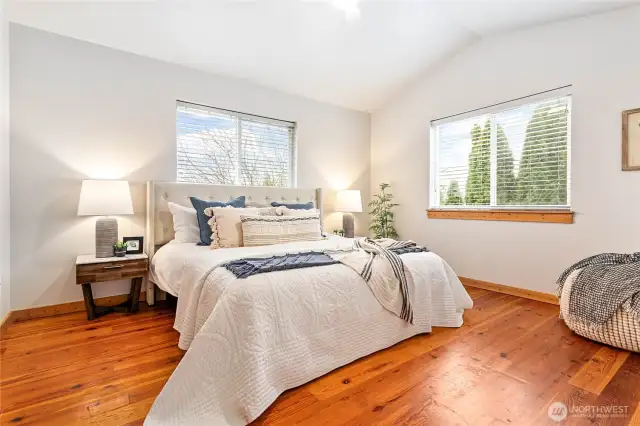 Owner's suite tucked away upstairs w/vaulted ceiling & lovely natural light