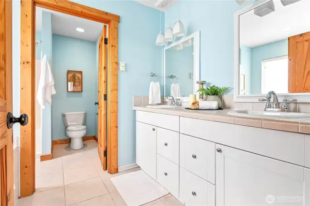 Ensuite bath w/dual vanity, separate room for shower & commode