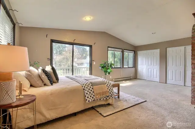 Large windows flood the home with natural light, creating a warm and inviting atmosphere.