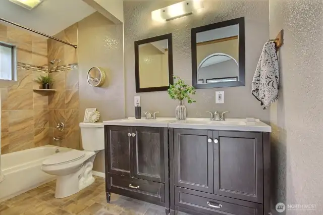 Enjoy a refreshed, modern primary bathroom with stylish finishes and ample storage.