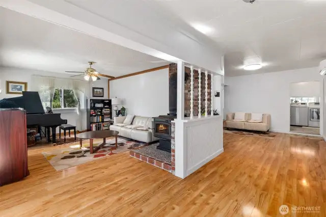 Lots of space to work with on the main level with a comfy living room and an open space on the right. Lots of possibilities. The laundry room and bathroom are through the opening on the right.