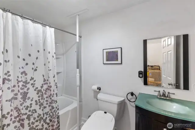 The full bath on the main level. The 2nd bathroom is access from the exterior of the home.