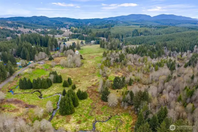 From one end of the property to the other. The home is in the middle on the left. This is a good shot of the meandering Power's Creek.
