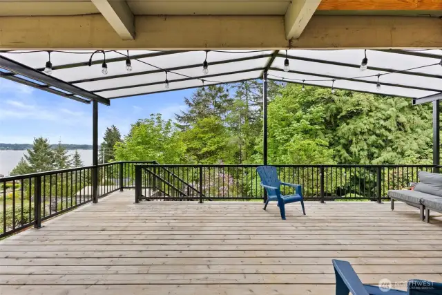 Large Covered deck to to sit and take in the morning sunrise or entertain.