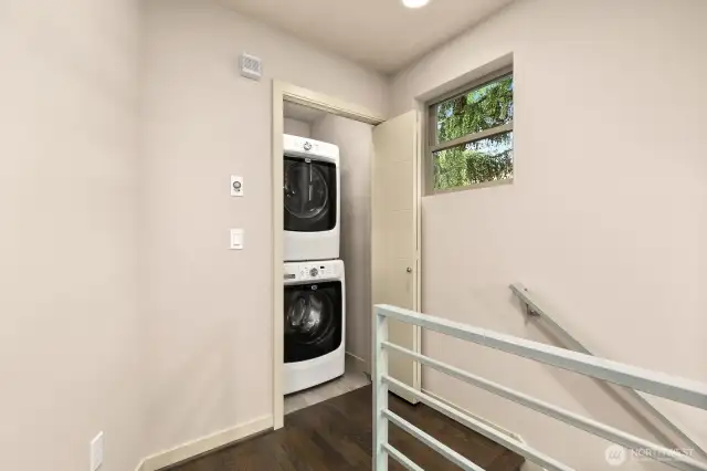 At the top of the stairs you have full-sized washer and dryer!