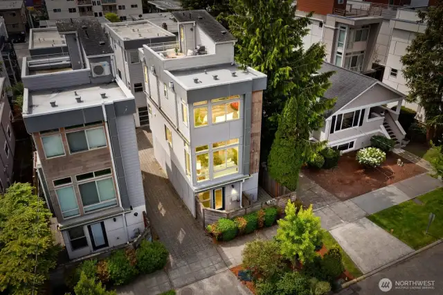 Fully standalone townhome with a private patio in front and a roof deck above. Garage is in back!