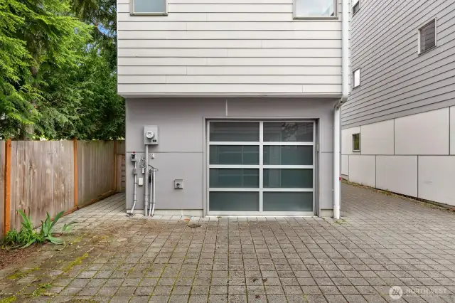 The driveway leads you to the attached garage.