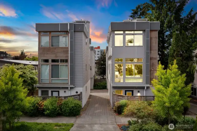 Note the driveway that leads back to the garage and two other units behind. All four units are standalone!