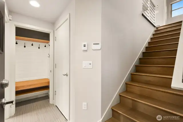 Entry! Stairs lead up to the living area, door to the left of the stairs is the garage. Farther to your left is the lower level bedroom/office and full bath.