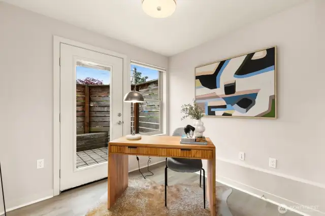 Lower level bedroom is staged a great flex space or office, and has access to the private patio out front.