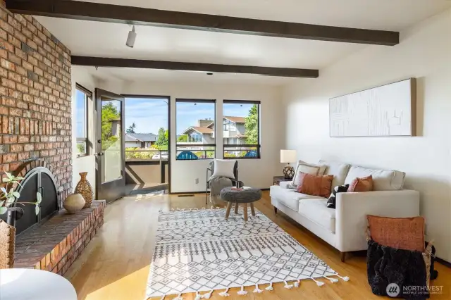 A granite-countered kitchen opens to a warming family room, complete with a grand brick wood-burning fireplace, the quintessence of hearth and home.
