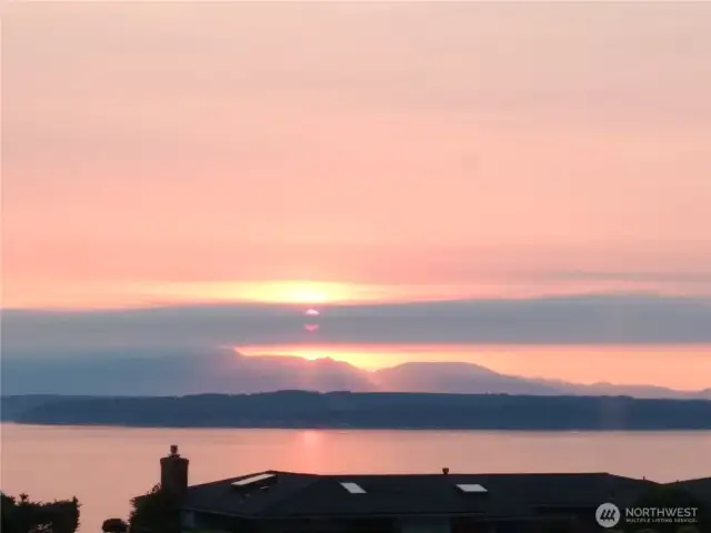 Pink skies at night, homeowner’s delight. No matter what hue the horizon is dressed up in, exquisite views of the mountains and water are yours to savor.
