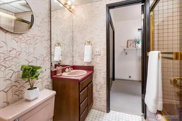 Talk about pretty in pink! The lower floor full bathroom brings artful details to what is normally considered a utilitarian space.