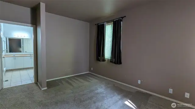 Primary bedroom looking into huge primary bathroom