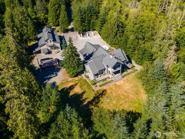 Looking down on to this beautiful estate of approximately 30 acres surrounded by evergreens, fruit trees a 8 ac lake and Haynie Creek.