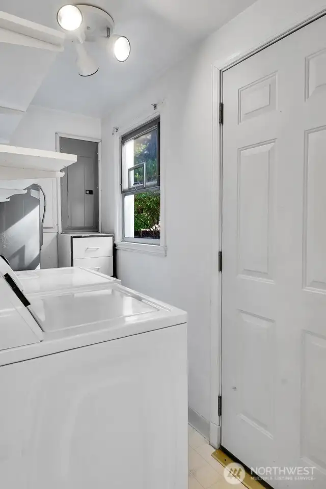 Utility/Mud room with access to huge backyard.
