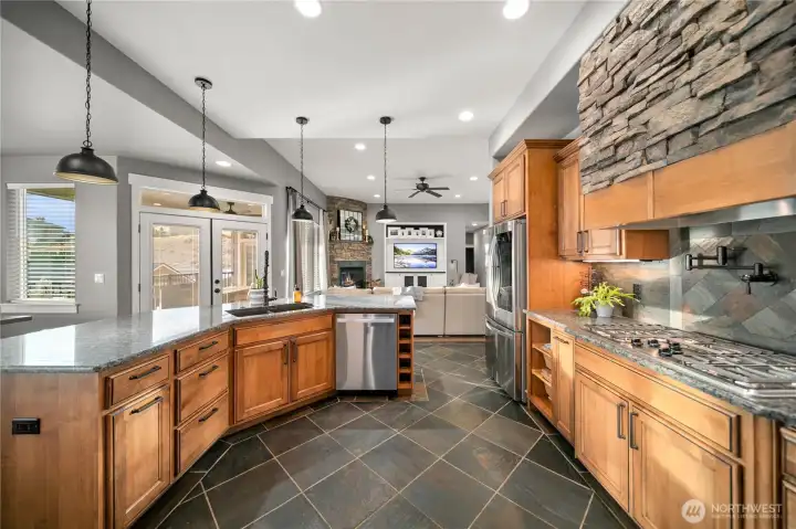 Large center island with stone accents and new pendant lights