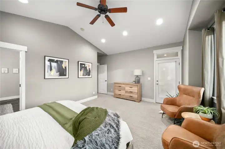 Soft designer tones and rich flooring create an inviting retreat with access to the deck.