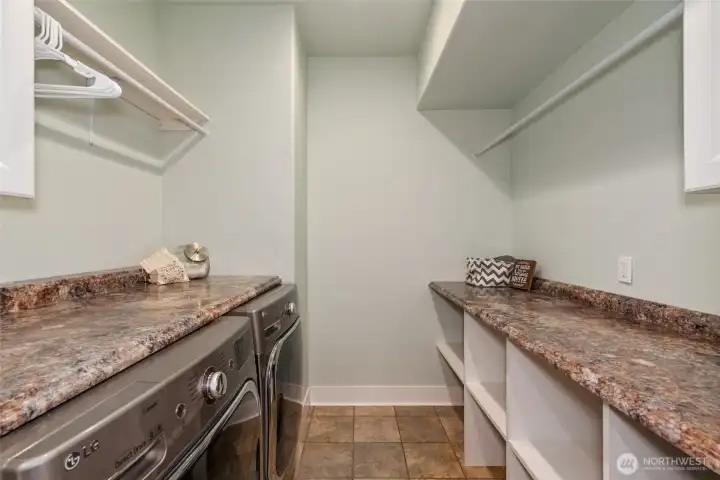 Main floor laundry offers abundant storage and counter space