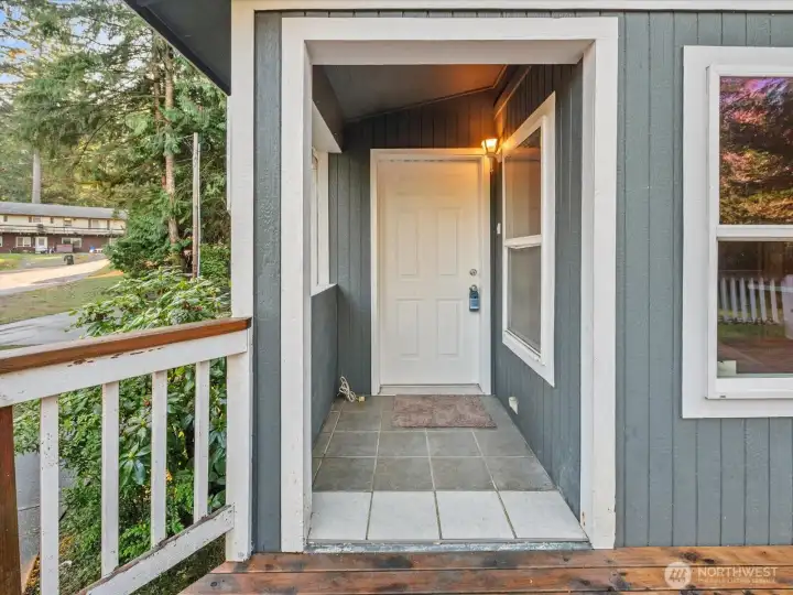 Covered front porch welcomes you and your guests