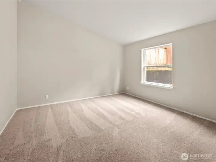 Vaulted ceilings continue in the 2nd bedroom
