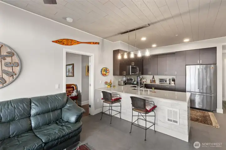 Spacious living room flows out onto the beautiful patio and into the kitchen. Fully tiled throughout the living room, kitchen and entryway. Just some of the amenities this unit has waiting for you.