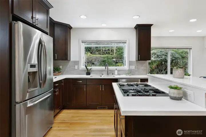 Grown your own herbs in the garden window with serene backyard views.