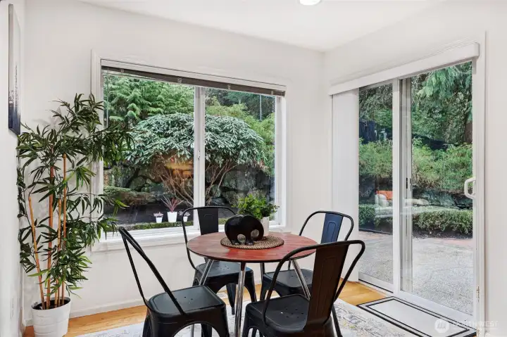 Garden views continue into the casual dining nook with a slider opening to the patio.