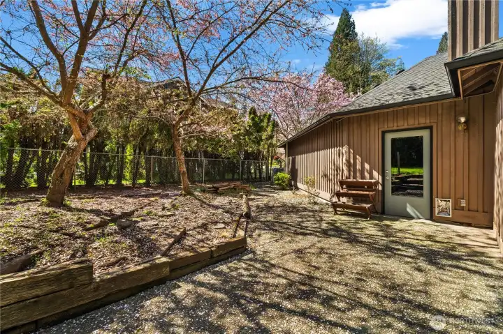 A back door to the garage shop area can access the patio and backyard