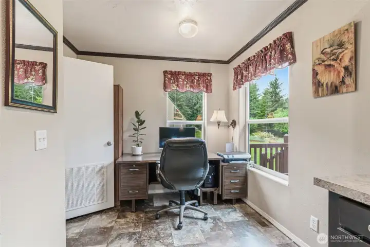 Breakfast nook currently used as bright office/work space.