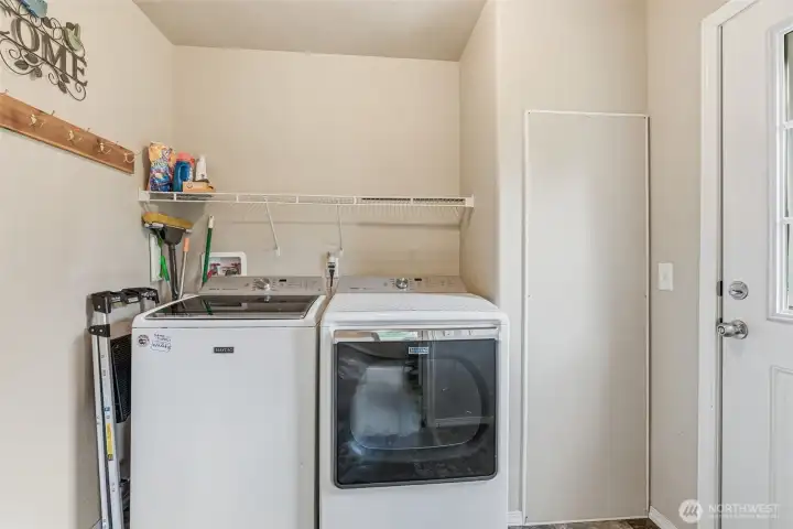 Dedicated laundry space w/extra storage potential; water heater closet.