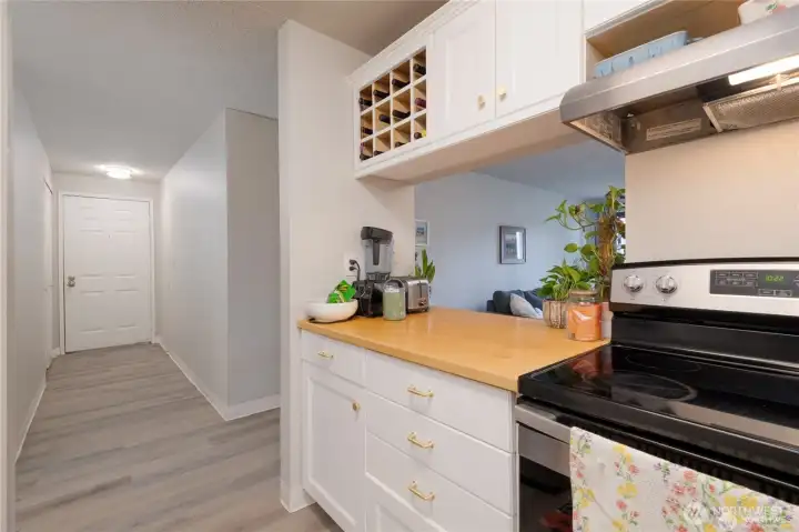 Welcoming entryway with a convenient entry closet. Enjoy LVP flooring throughout the unit for easy maintenance and cleaning. The beautifully updated kitchen is sure to please with Custom Butcher block and quartz countertops, Stainless Steel Appliances and Shaker cabinetry!