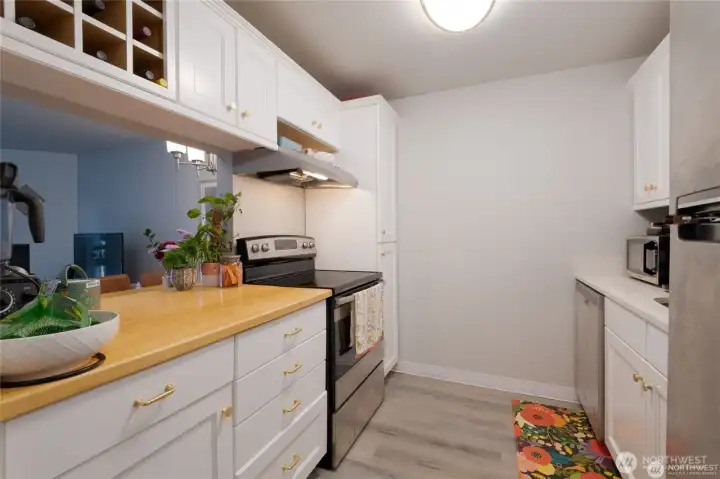 Beautifully remodeled kitchen featuring all-new, white Shaker cabinetry, countertops and modern finishes.