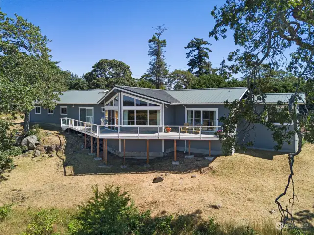 View side of home with expansive deck.