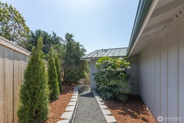 Path to back yard from driveway parking.